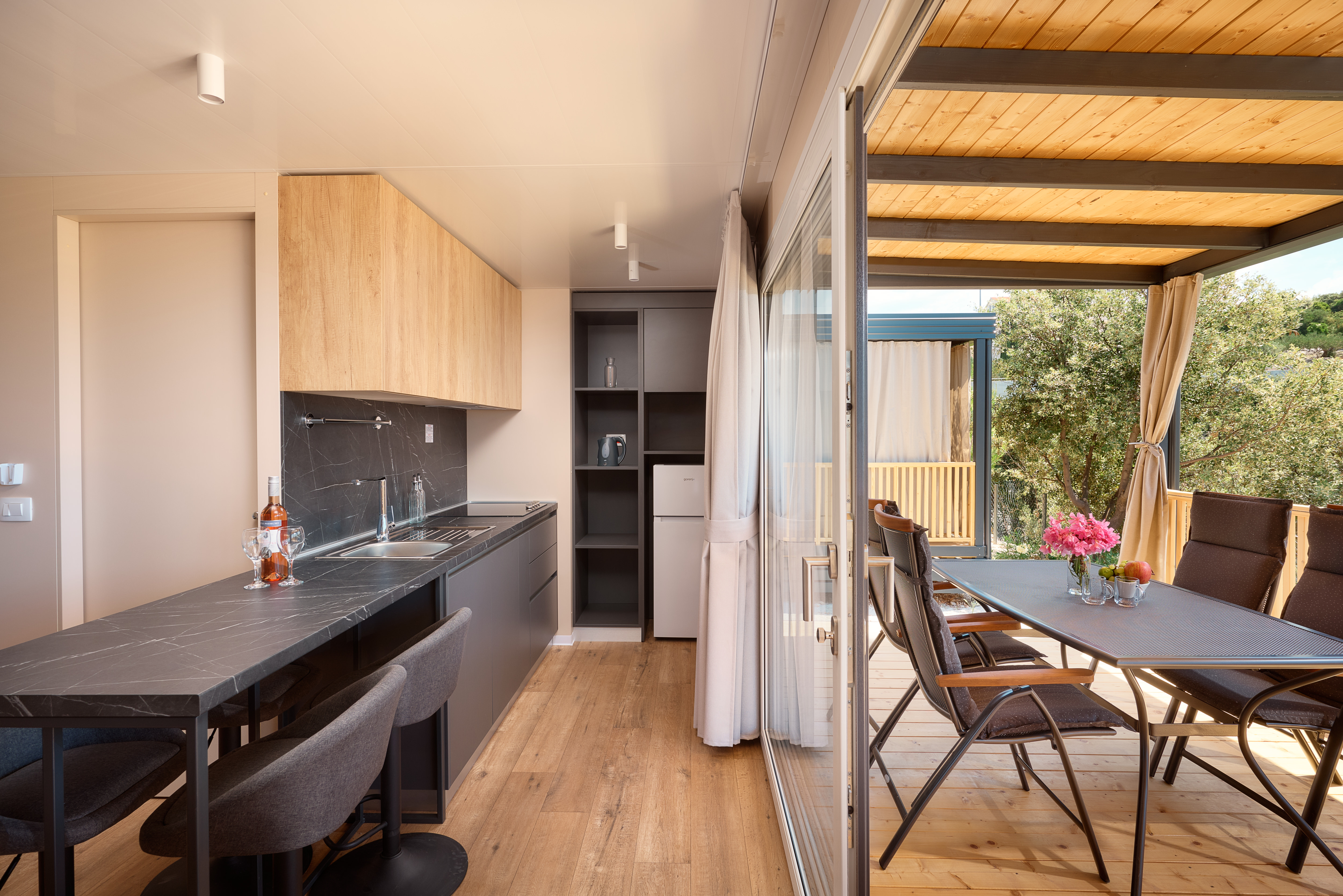 Kitchen and dining area opening to the terrace