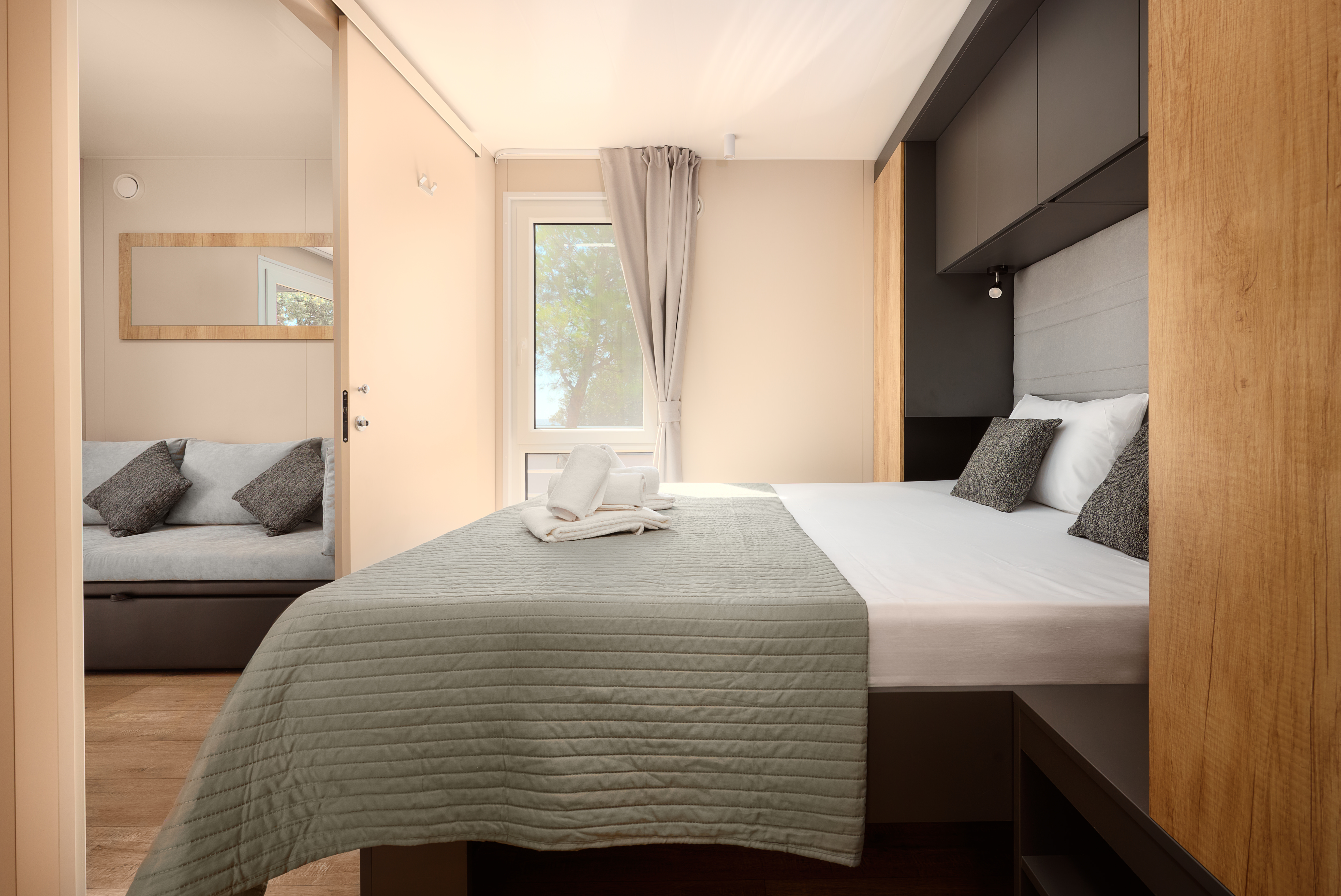 Bedroom with sofa and sea-facing window