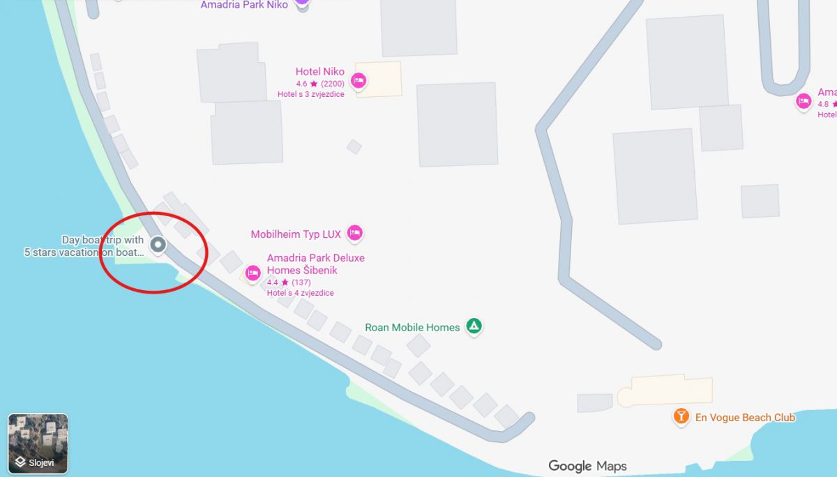 Map with the pickup point circled in red on the waterfront, a hotel and mobile homes marked nearby